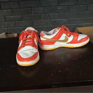 Nike Red and Gold Sneakers Classic Low-Top Design